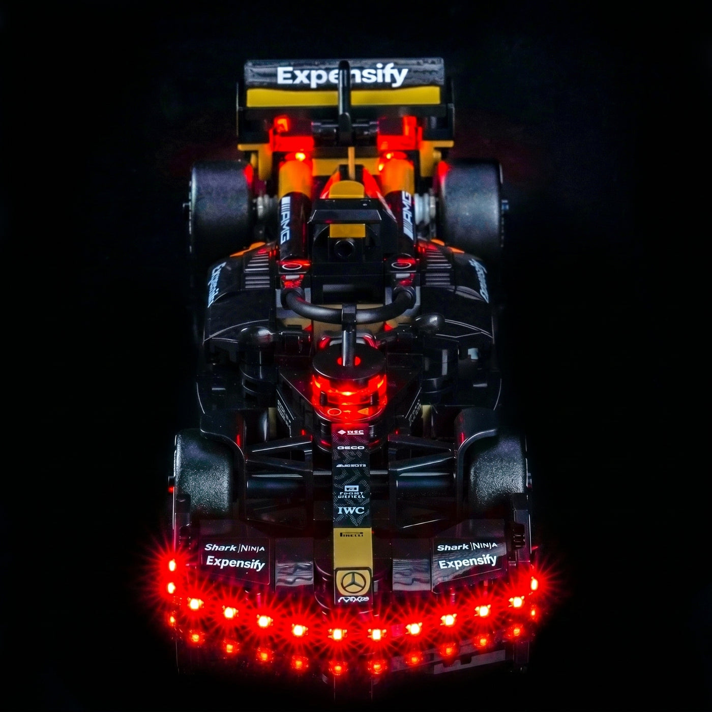 LEGO® Speed Champions APXGP Team Race Car from F1 The Movie #77252 showcase lighting view, with the LED lights