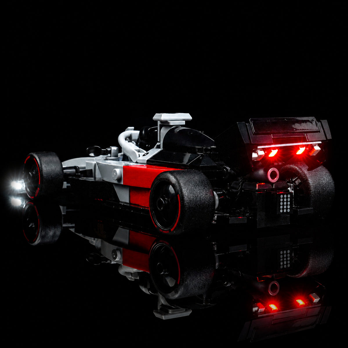 LEGO® Speed Champions Audi Revolut F1 Team R26 Race Car #77259 warm LED glow detail, with the LED lights