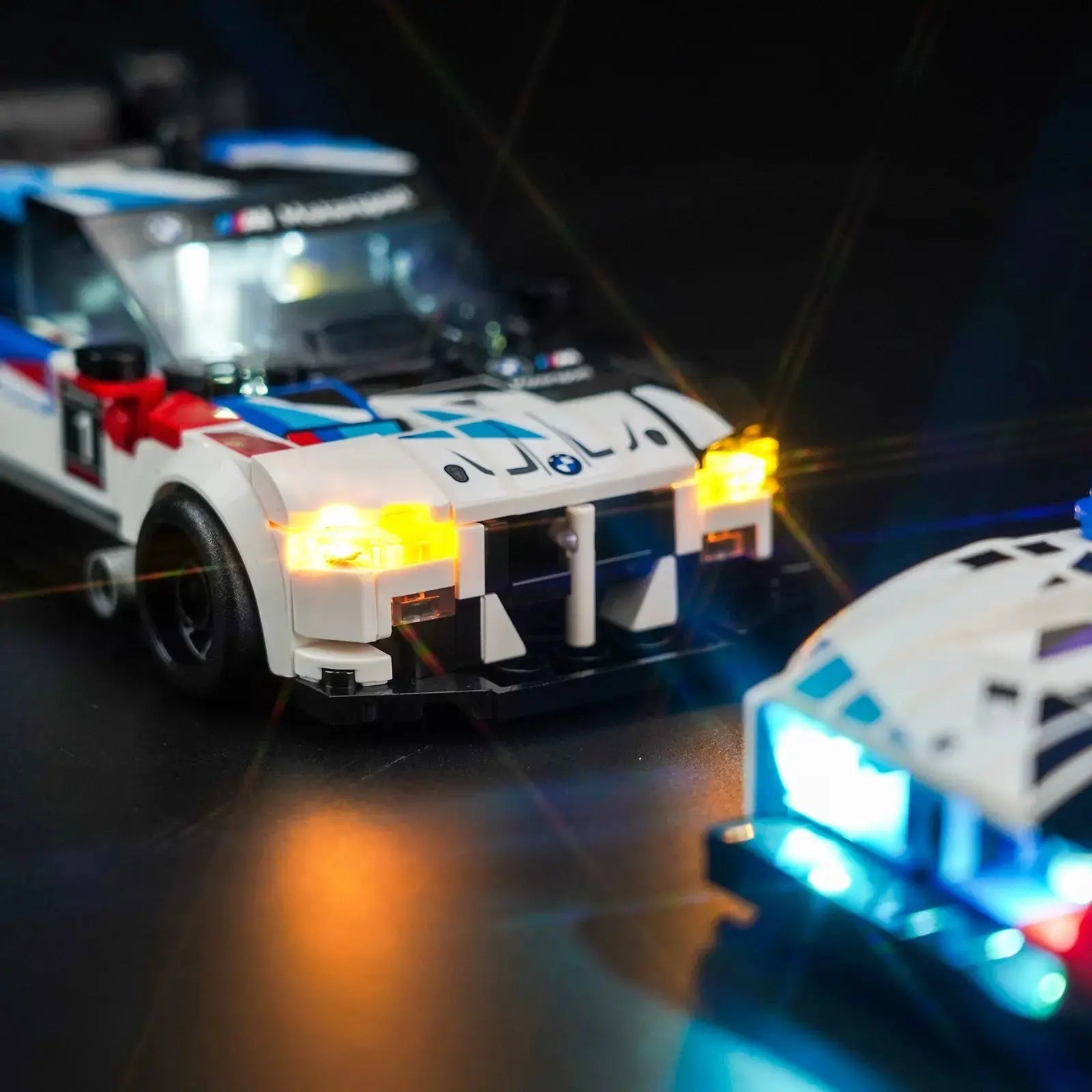 Close-up of LED lights on LEGO Speed Champions BMW M4 GT3 & BMW M Hybrid V8 Race Cars #76922
