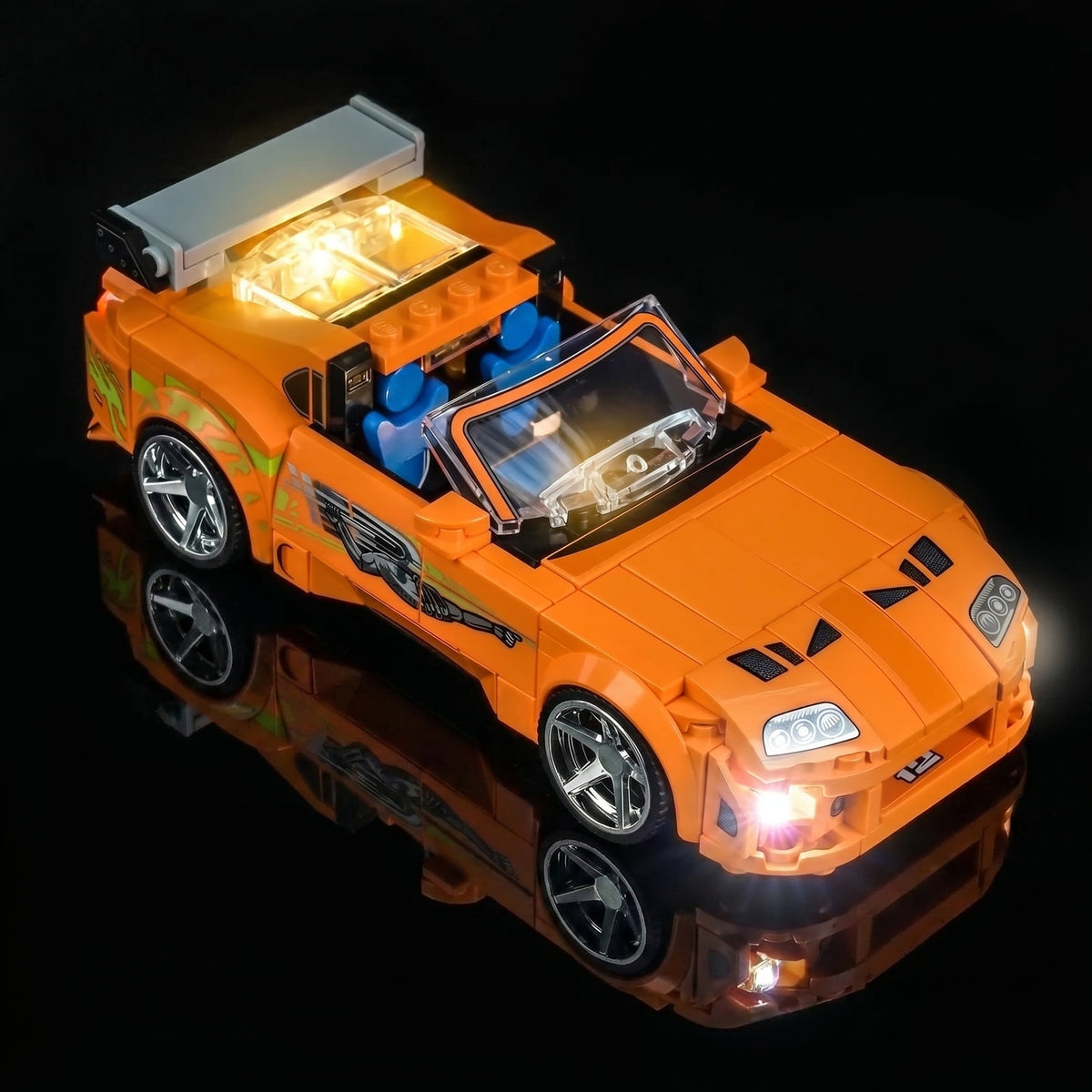 LEGO® Speed Champions Fast and Furious Toyota Supra MK4 #77260 side angle with lights on, with the LED lights