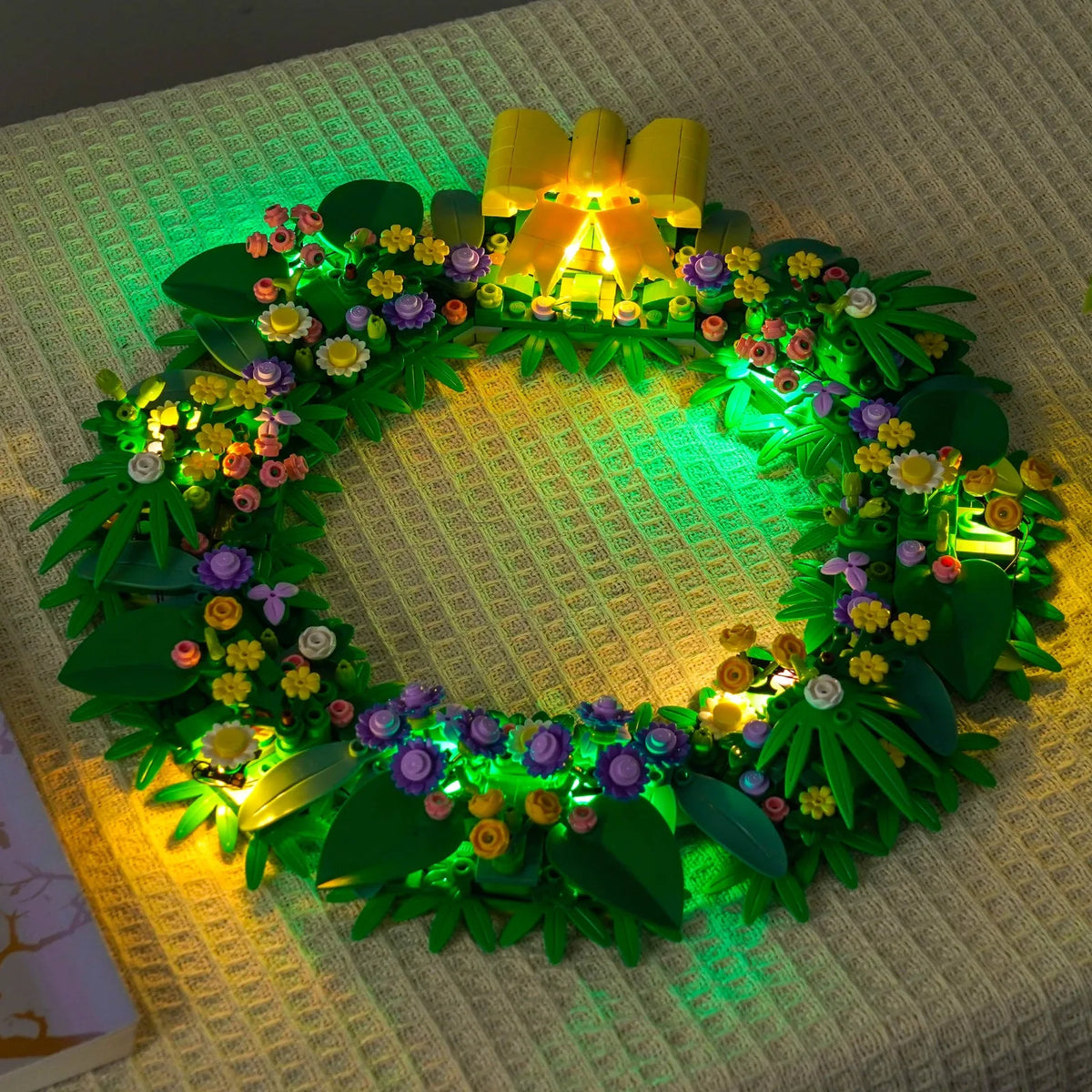 LEGO® Spring Wreath #40957 installed and glowing, with the LED lighting kit