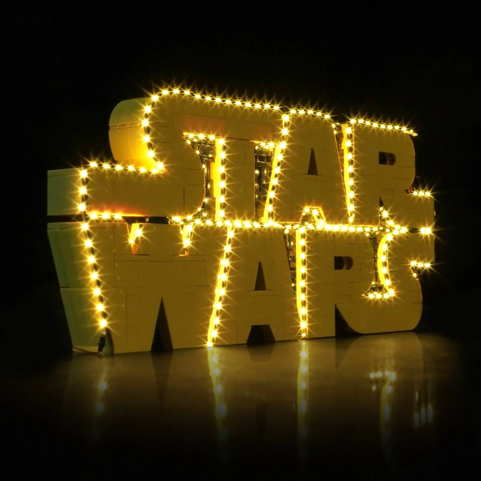 LEGO Star Wars Brick-Built Star Wars Logo #75407 illuminated at night