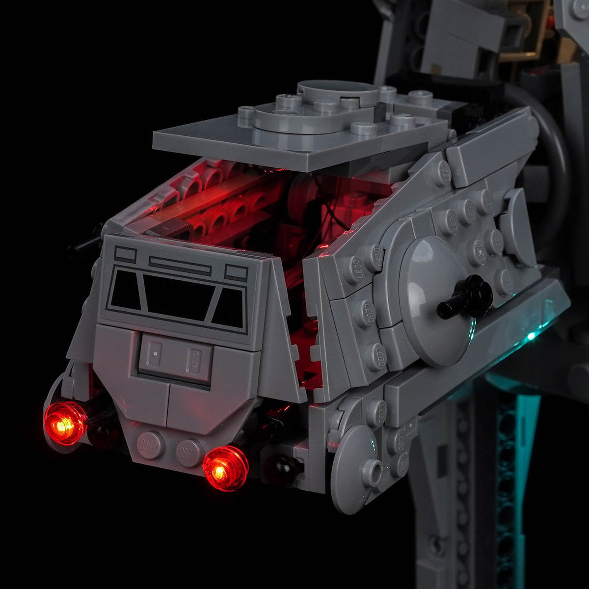 Close-up of the head of LEGO Imperial Remnant AT-AT 75454: twin red chin lamps and red glow inside