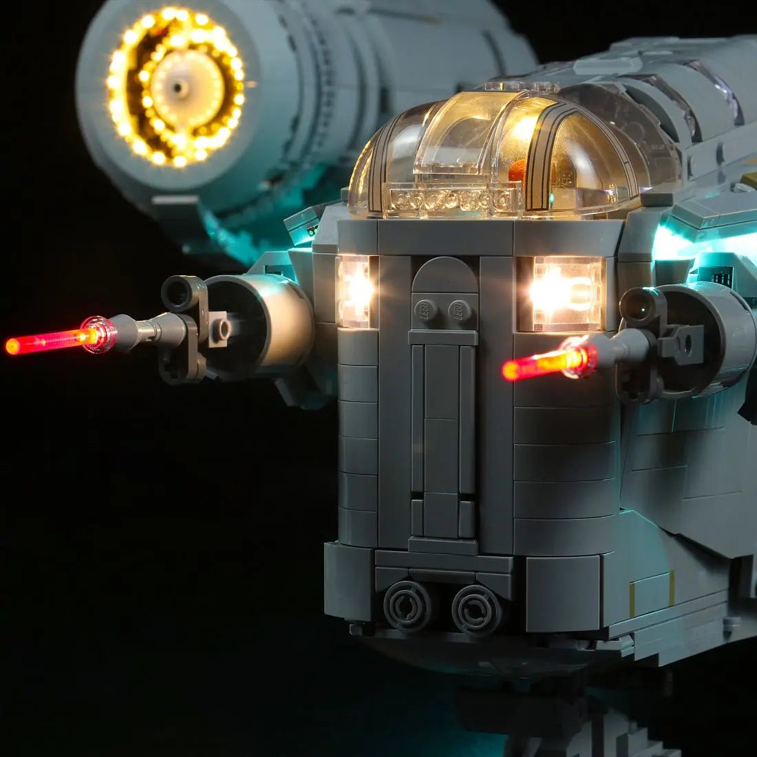 LEGO® Star Wars The Razor Crest #75331 illuminated at night, with the light kit