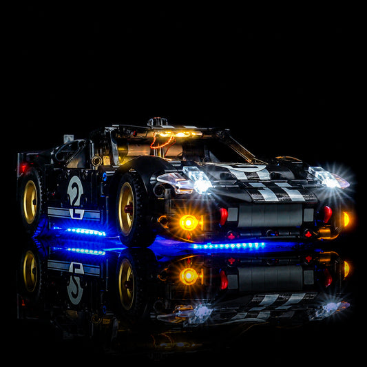 LEGO® Technic 1966 Ford GT40 MKII Race Car #42223 illuminated at night, with the LED light kit