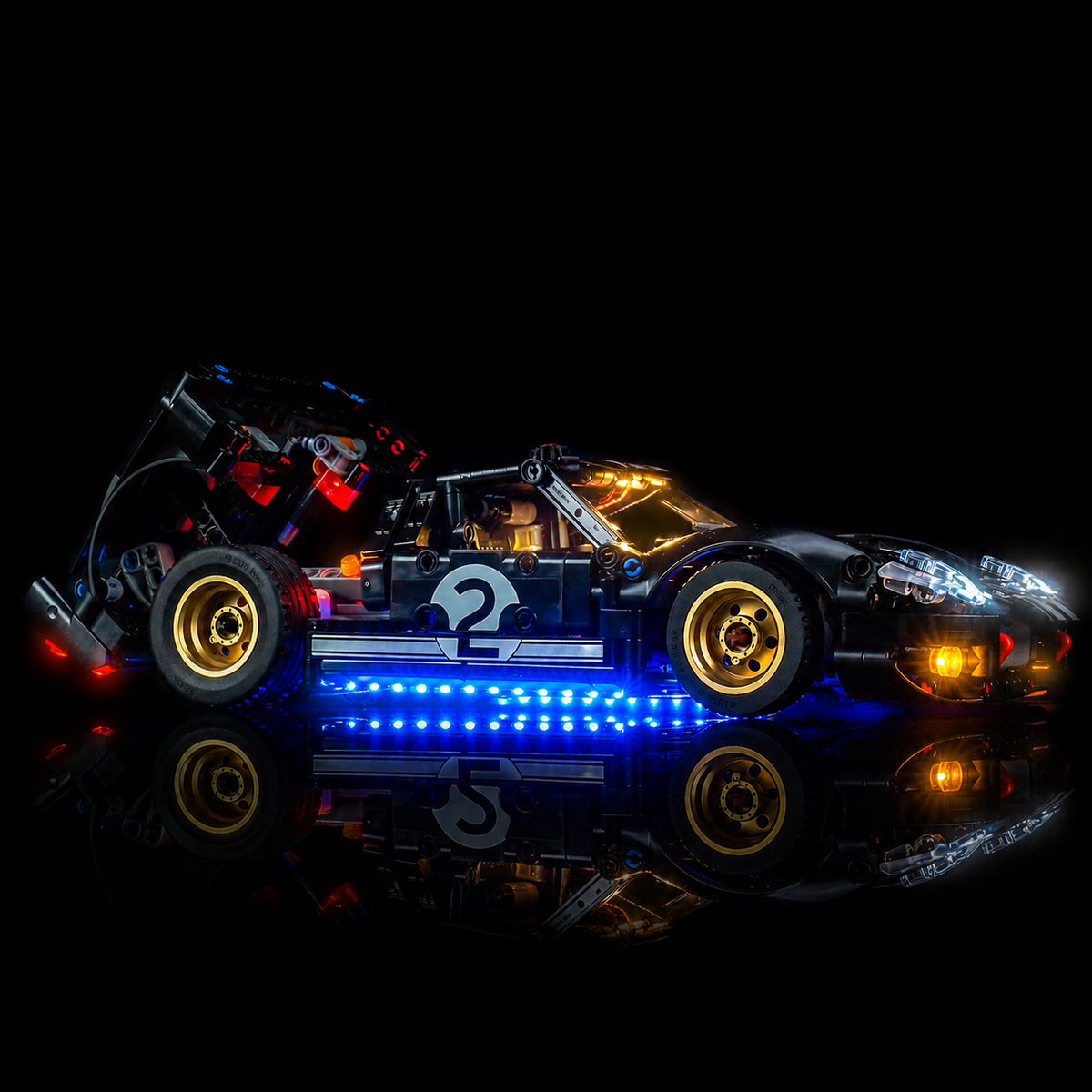 side angle with lights on: Bright My Bricks RGB LED light kit for LEGO® Technic 1966 Ford GT40 MKII Race Car #42223