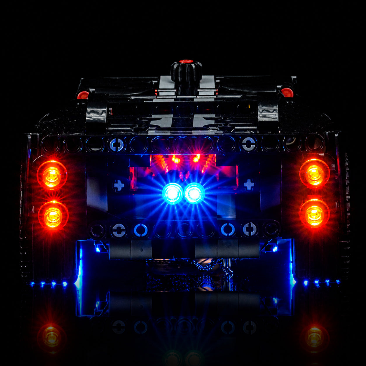 LEGO® Technic 1966 Ford GT40 MKII Race Car #42223 illuminated at night, with the RGB LED light kit