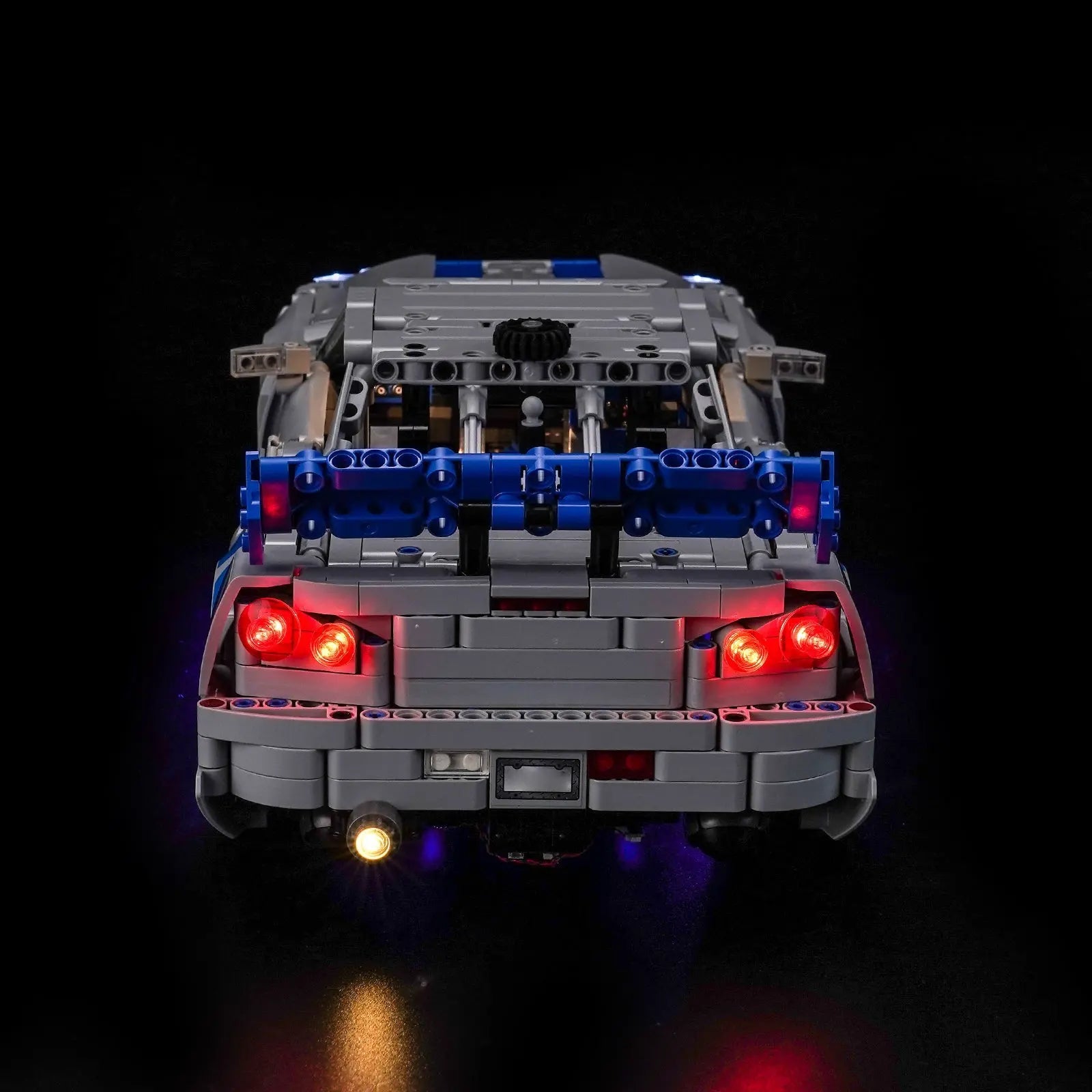 LEGO Technic 2 Fast 2 Furious Nissan Skyline GT-R (R34) #42210 illuminated at night