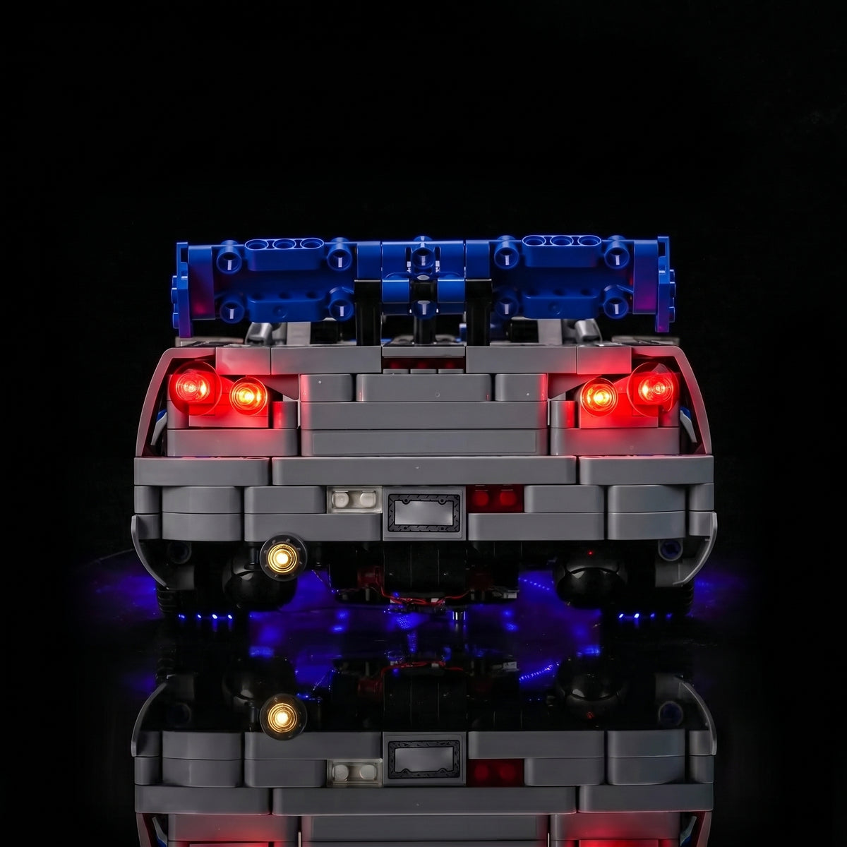 LEGO® Technic 2 Fast 2 Furious Nissan Skyline GT-R (R34) #42210 display lighting in a dark room, with the RGB LED light kit