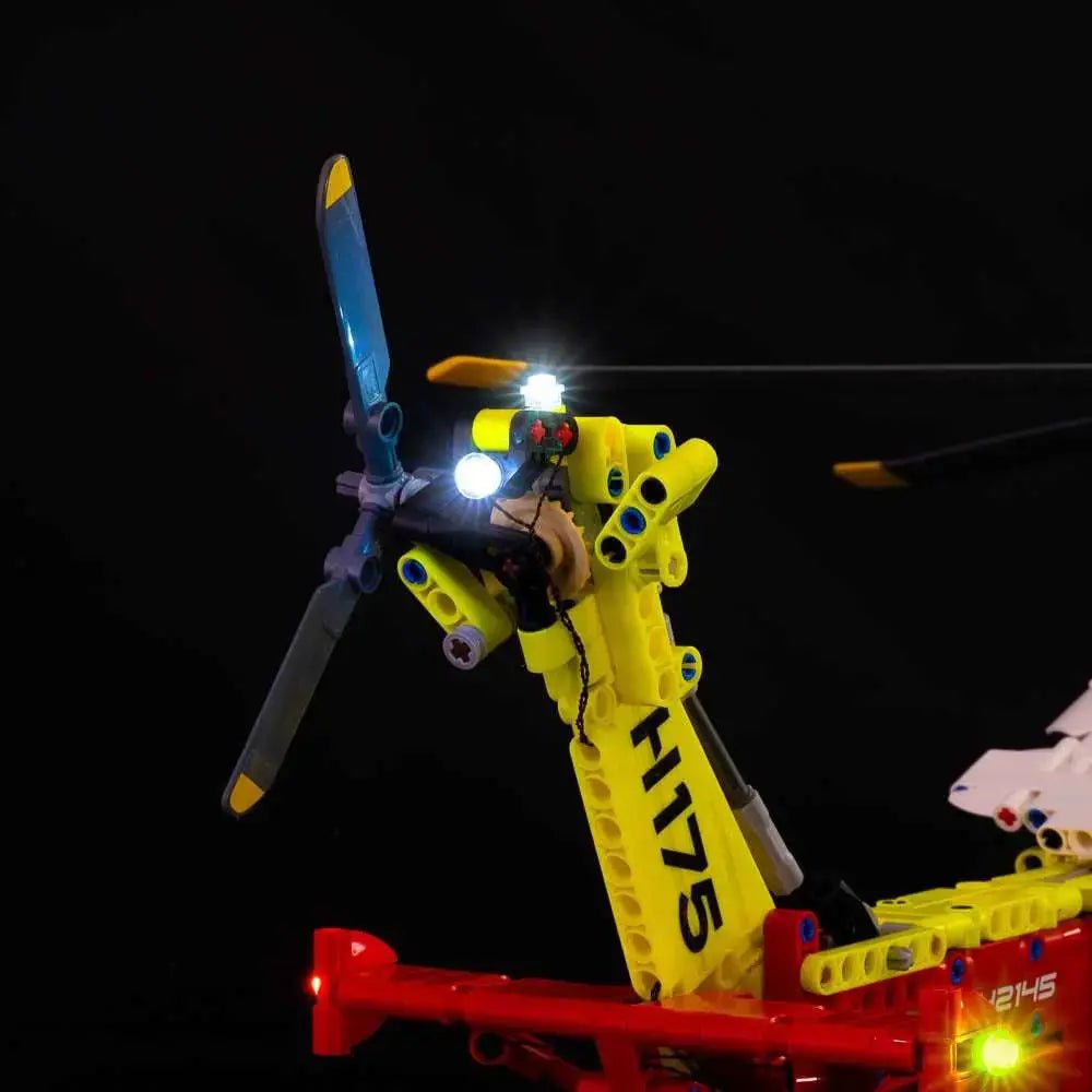 LEGO® Technic Airbus H175 Rescue Helicopter #42145 illuminated at night, with the DIY LED light kit
