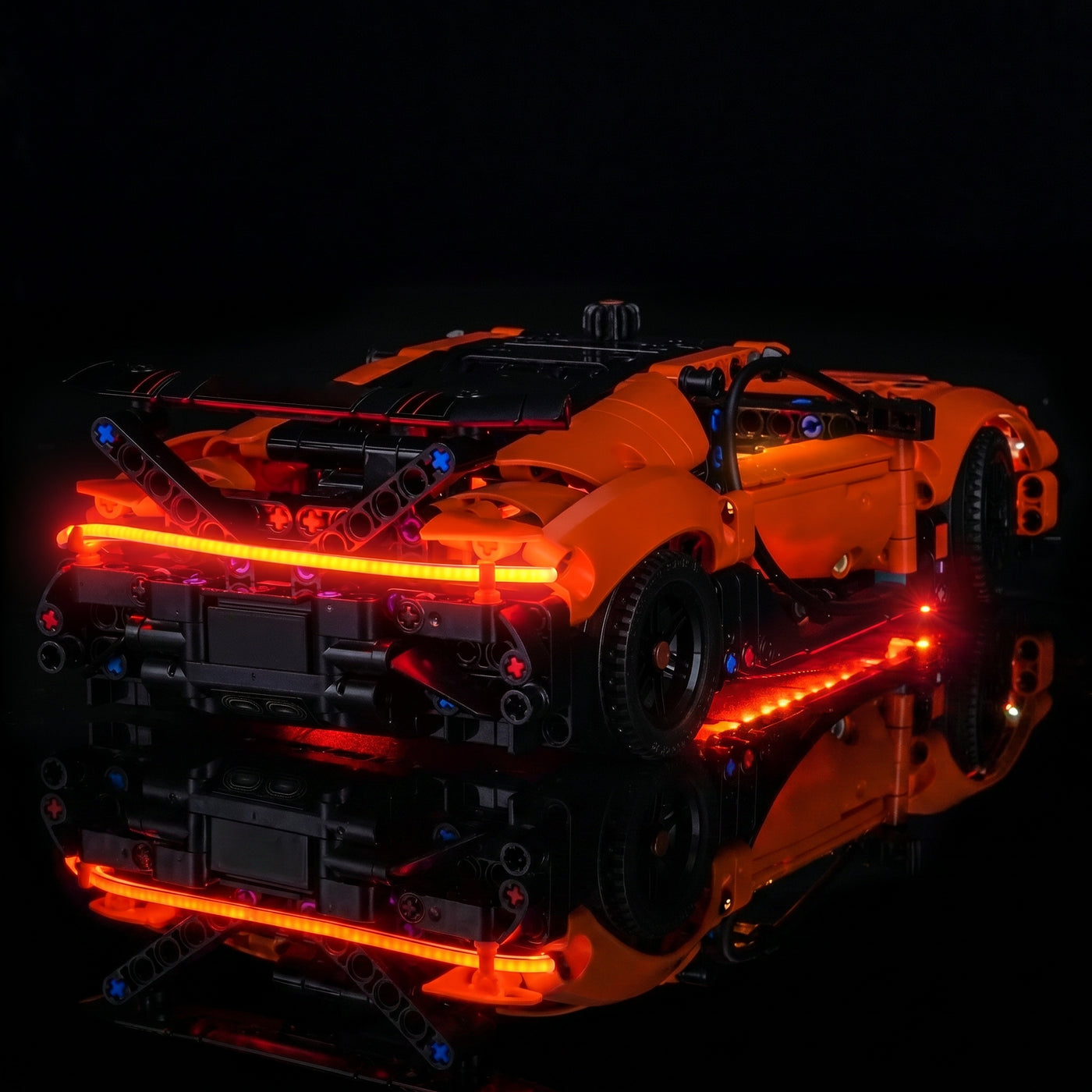 LEGO® Technic Bugatti Chiron Pur Sport Hypercar #42222 fully illuminated on display, with the premium LED light kit