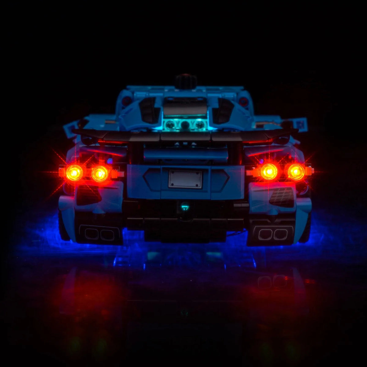 LEGO® Technic Chevrolet Corvette Stingray Blue #42217 illuminated at night, with the display light kit