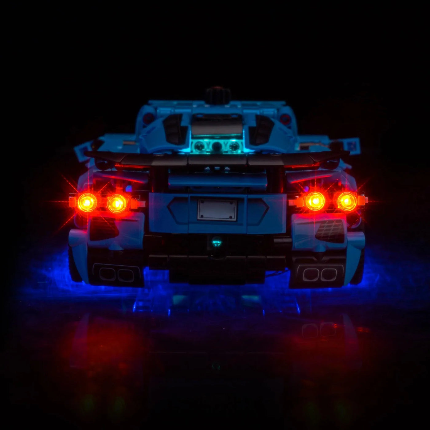 LEGO® Technic Chevrolet Corvette Stingray Blue #42217 illuminated at night, with the display light kit