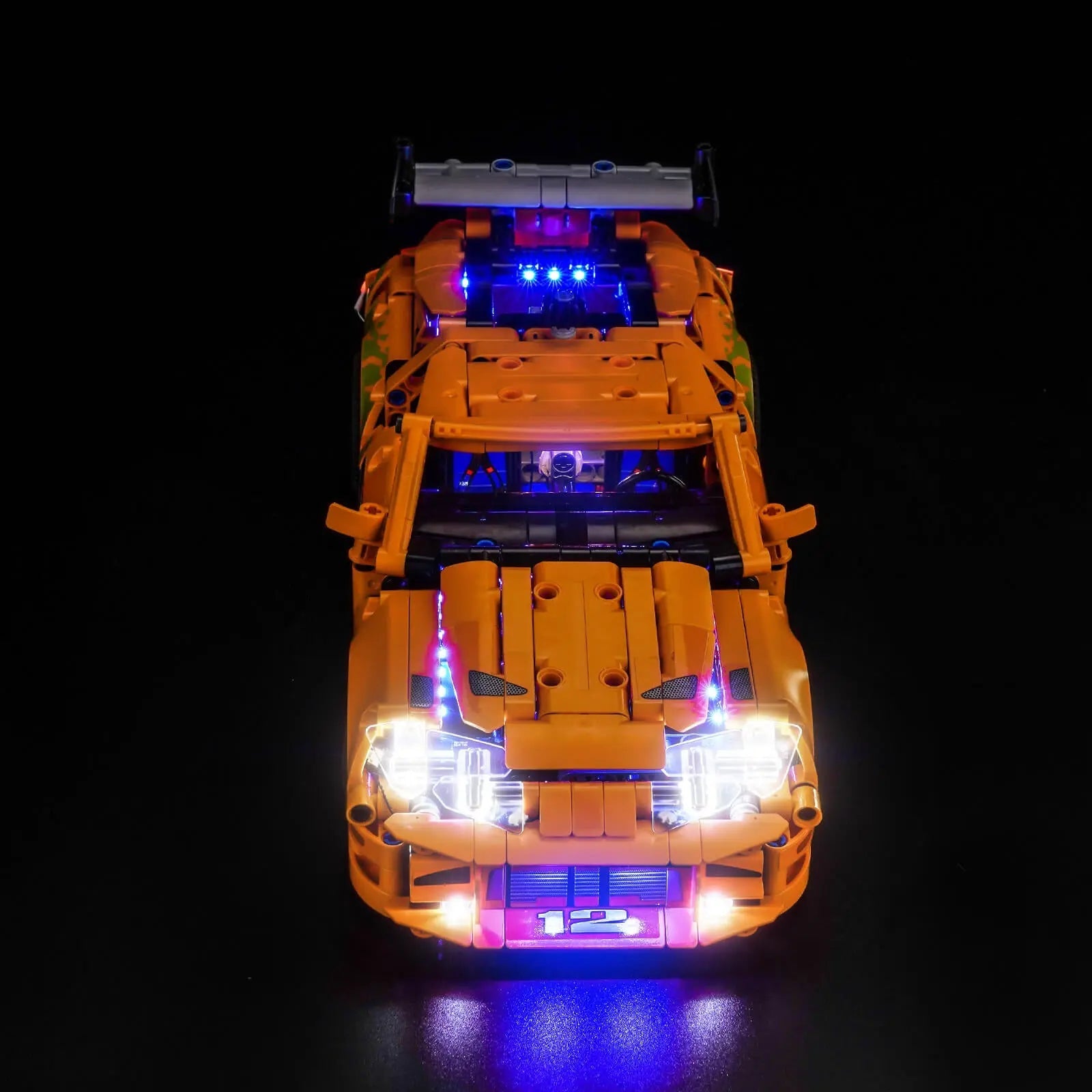 LEGO Technic Fast and Furious Toyota Supra MK4 #42204 illuminated at night