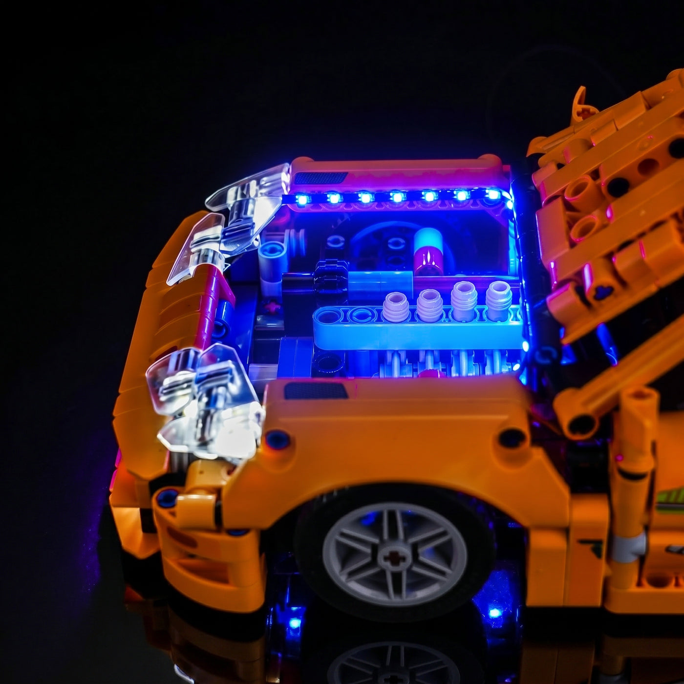 LEGO® Technic Fast and Furious Toyota Supra MK4 #42204 front view fully lit, with the premium LED light kit