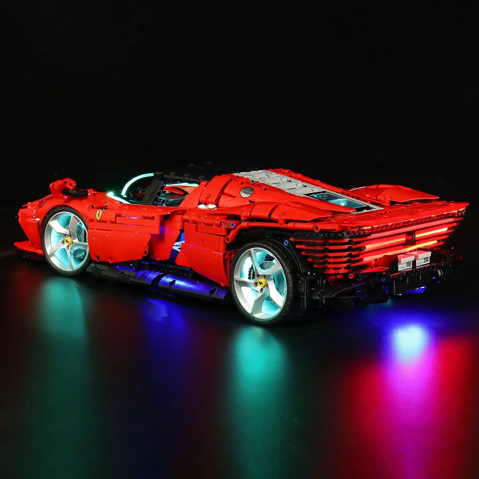 LEGO Technic Ferrari Daytona SP3 #42143 illuminated at night