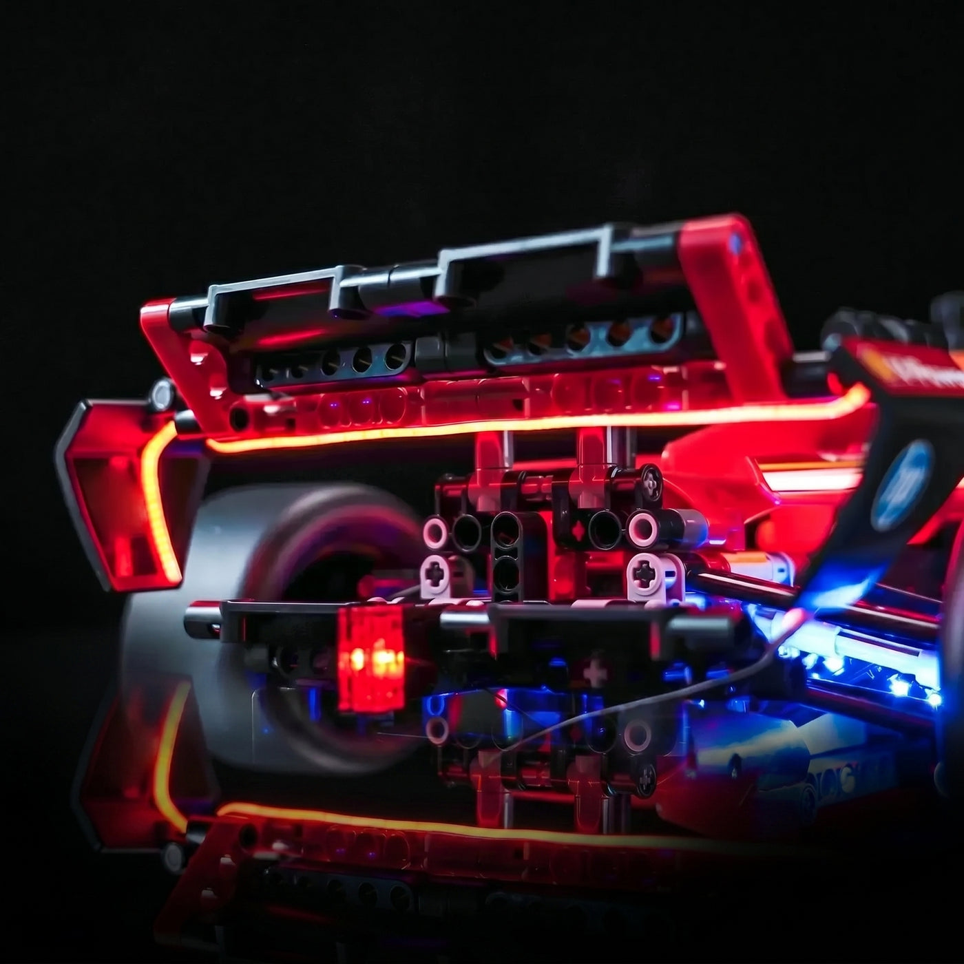 LEGO® Technic Ferrari SF-24 F1 Car #42207 brightened interior detail, with the LED lights