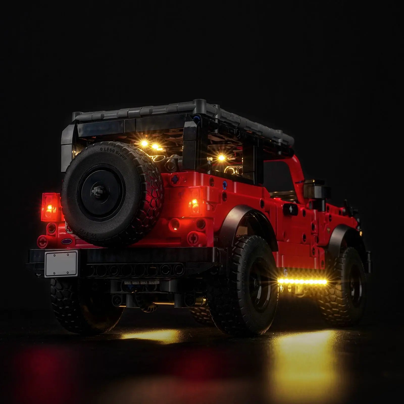 LEGO Technic Ford Bronco SUV #42213 illuminated at night