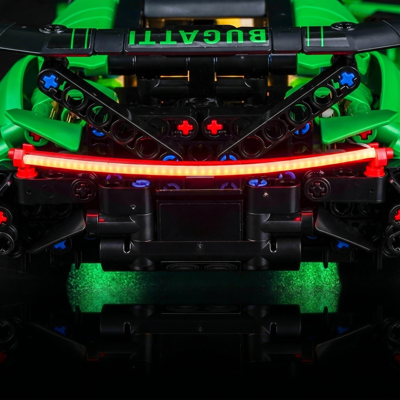 LEGO® Technic Green Bugatti Chiron Pur Sport Hypercar #42241 fully illuminated on display, with the DIY LED light kit
