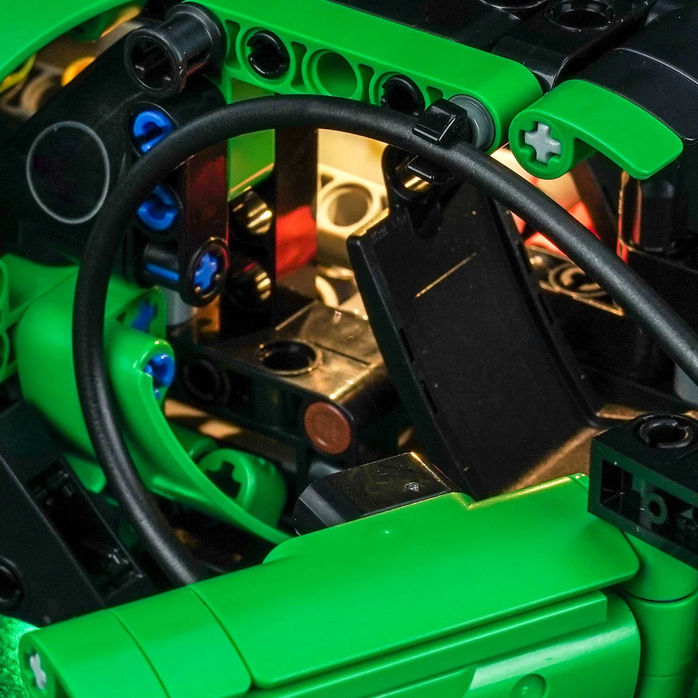 LEGO® Technic Green Bugatti Chiron Pur Sport Hypercar #42241 display lighting in a dark room, with the LED lighting kit