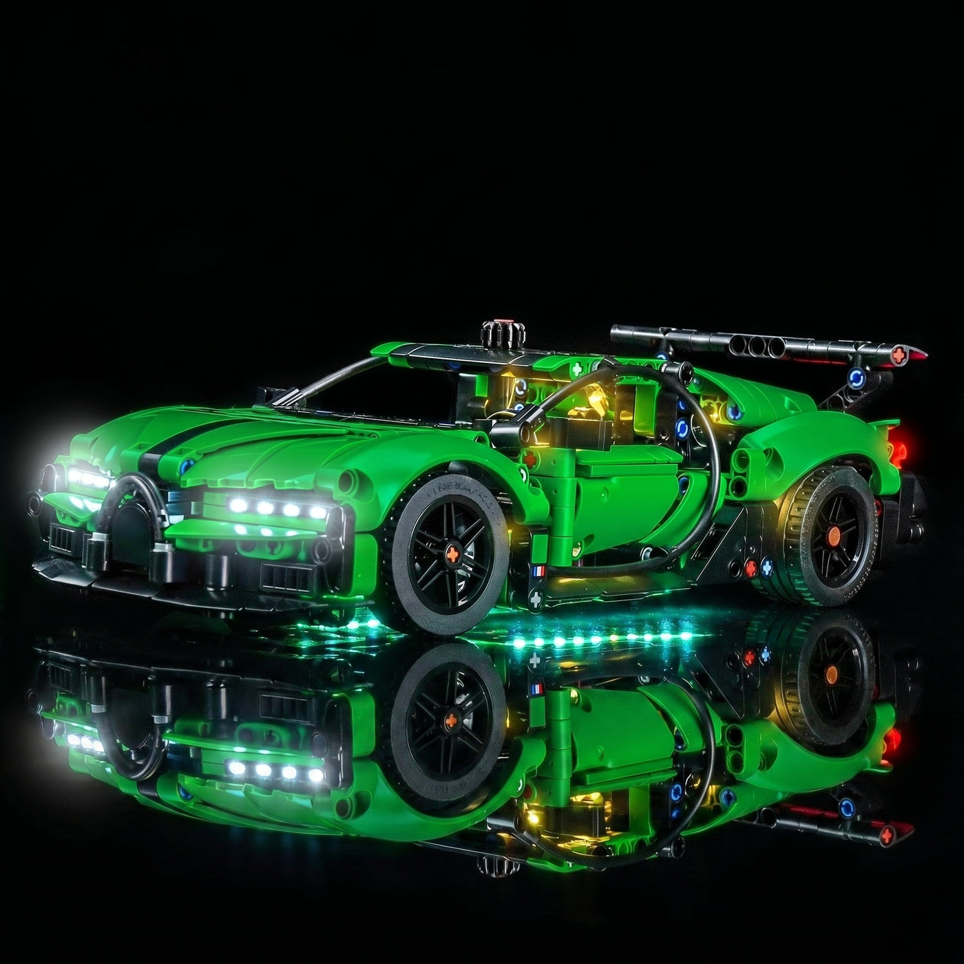 LEGO® Technic Green Bugatti Chiron Pur Sport Hypercar #42241 illuminated at night, with the light kit