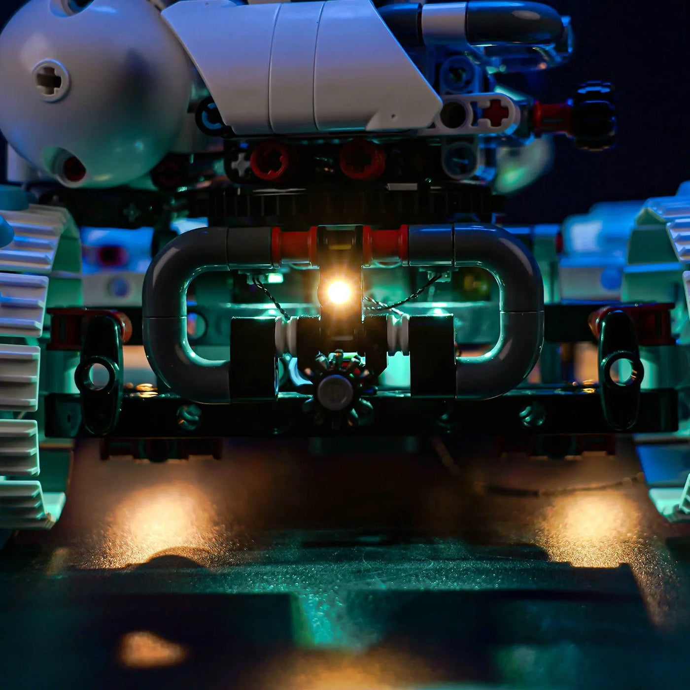 LEGO® Technic Lunar Outpost Moon Rover Space Vehicle #42211 front view fully lit, with the LED lights