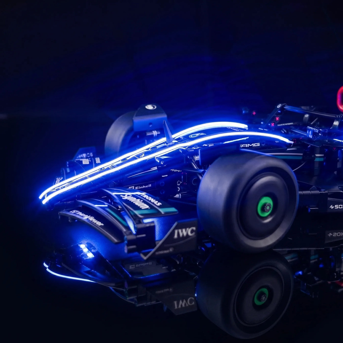 LEGO® Technic Mercedes-AMG F1 W14 E Performance #42171 — side angle with lights on (LED lights)