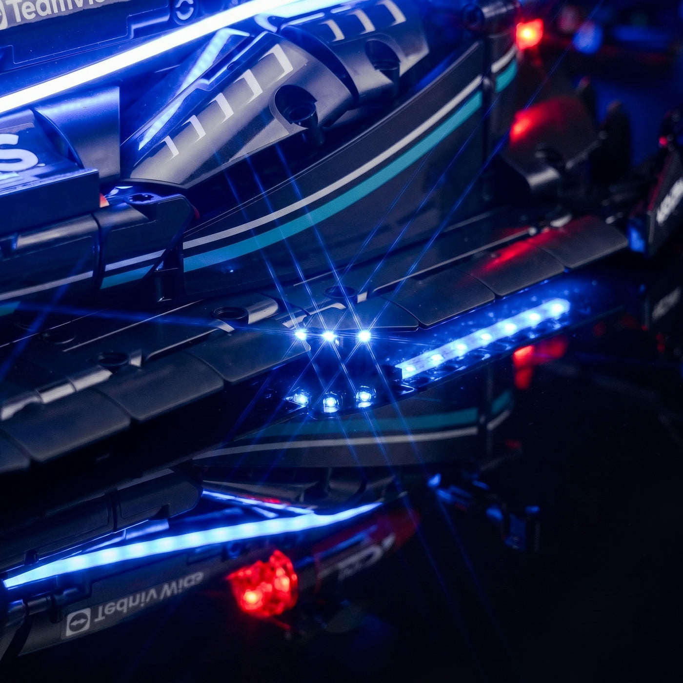 LEGO® Technic Mercedes-AMG F1 W14 E Performance #42171 LED kit powered on, with the premium LED light kit