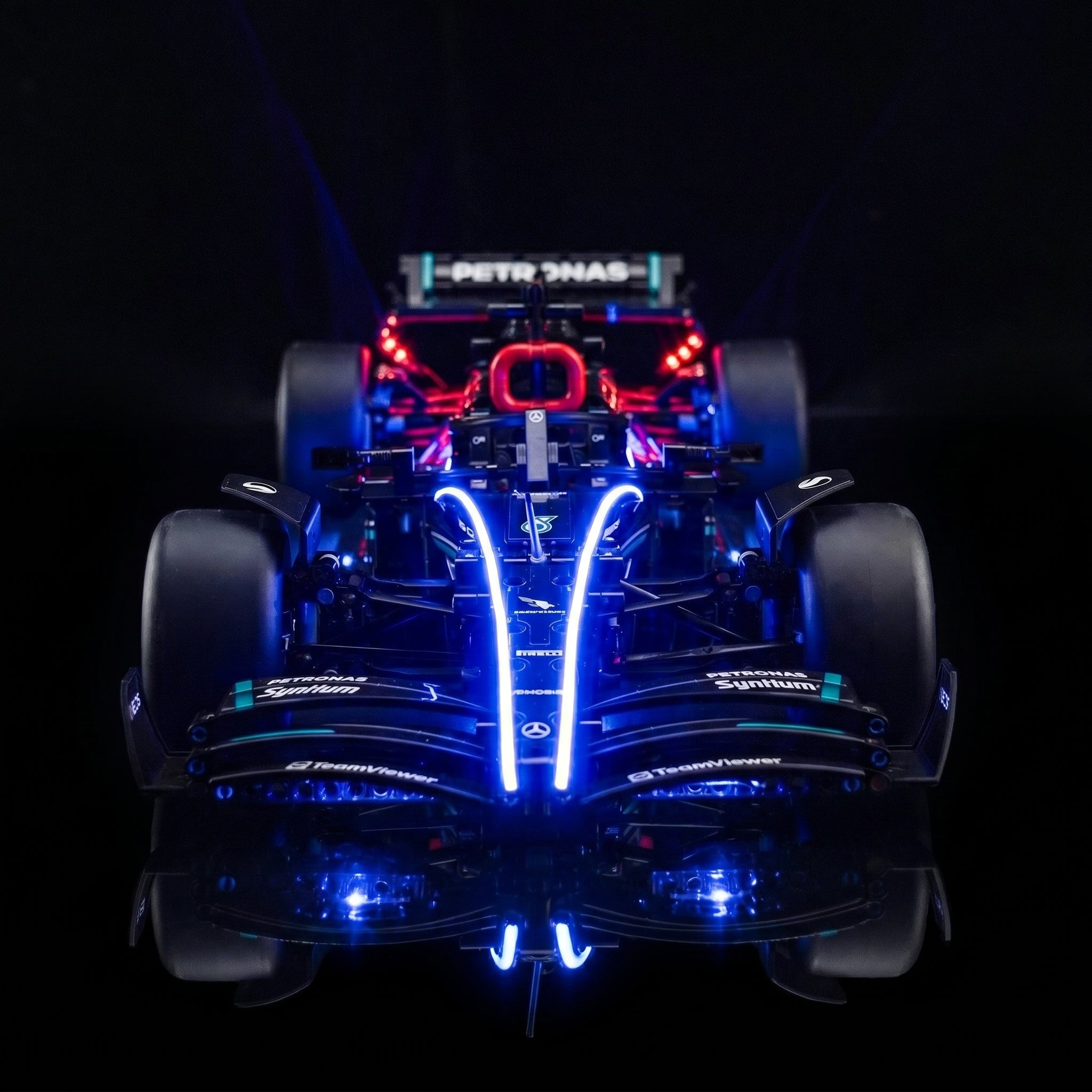 LEGO® Technic Mercedes-AMG F1 W14 E Performance #42171 — side angle with lights on (display light kit)