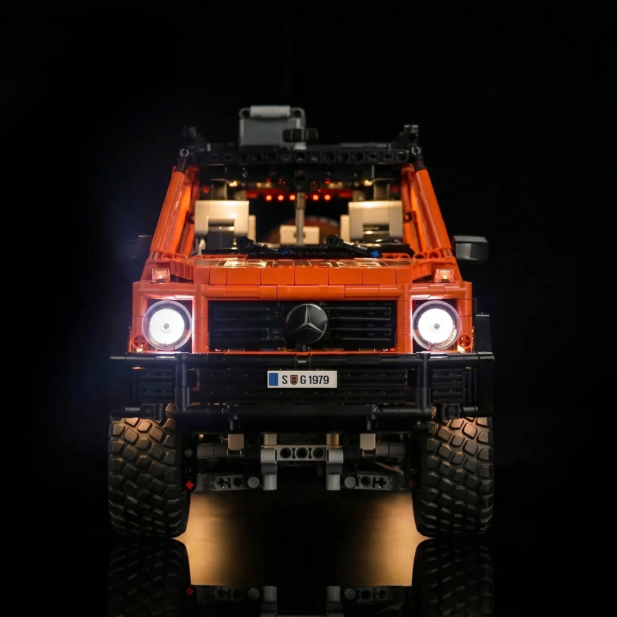 LEGO® Technic Mercedes-Benz G 500 PROFESSIONAL Line #42177 illuminated at night, with the light kit