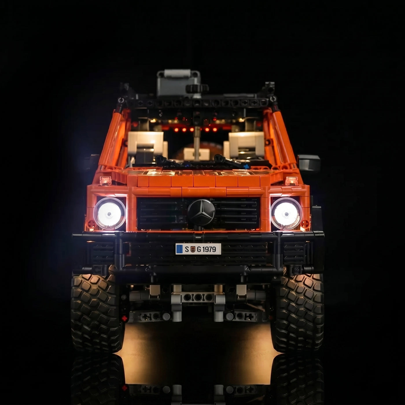 LEGO® Technic Mercedes-Benz G 500 PROFESSIONAL Line #42177 illuminated at night, with the light kit