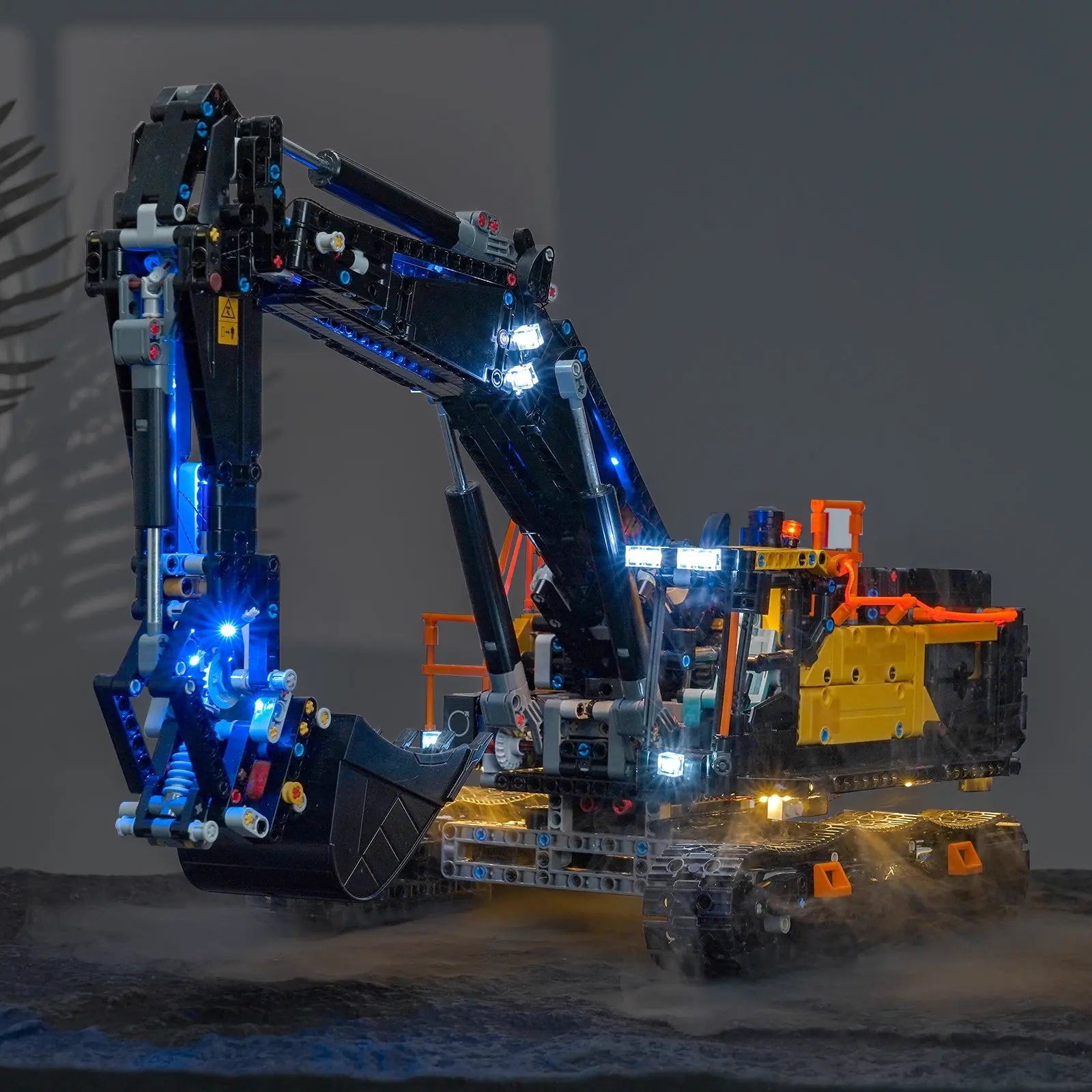 side angle with lights on: Bright My Bricks custom LED lighting for LEGO® Technic Volvo EC500 Hybrid Excavator #42215