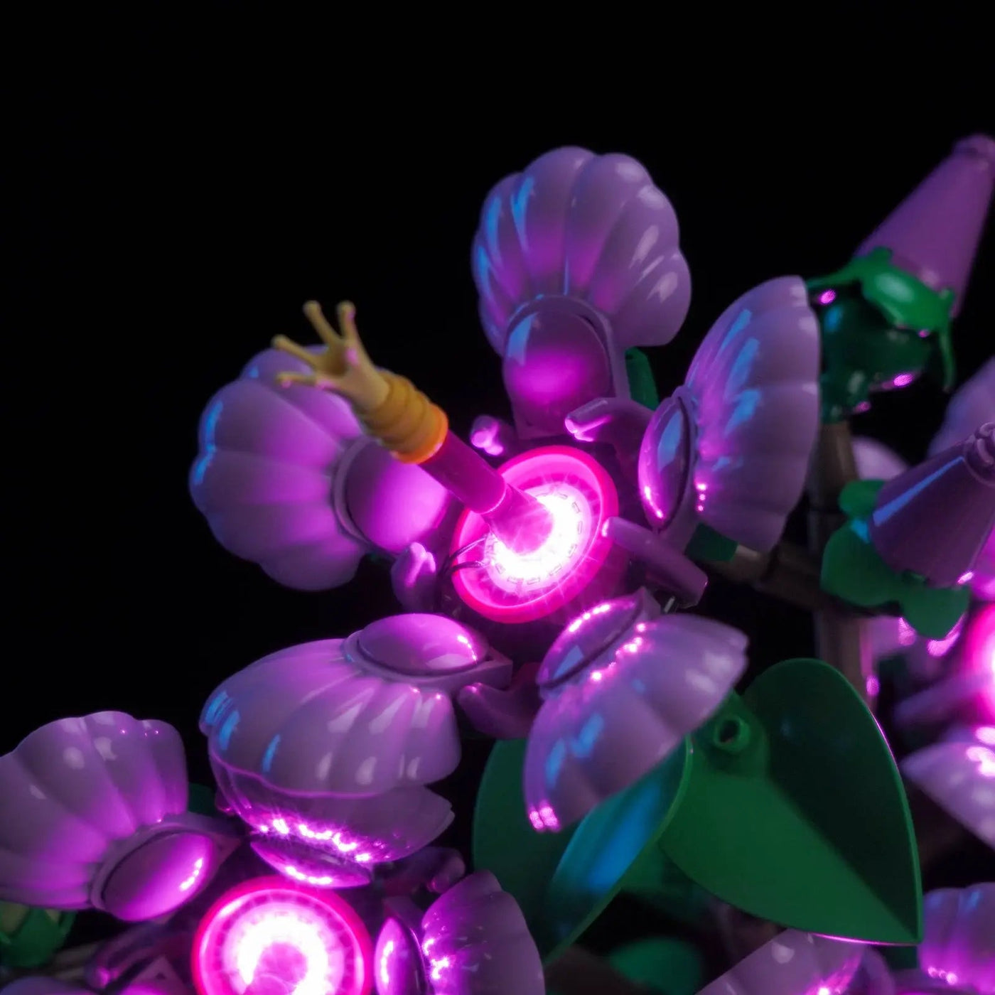 LEGO® The Botanical Collection Hibiscus #10372 side angle with lights on, with the USB-powered LED light kit