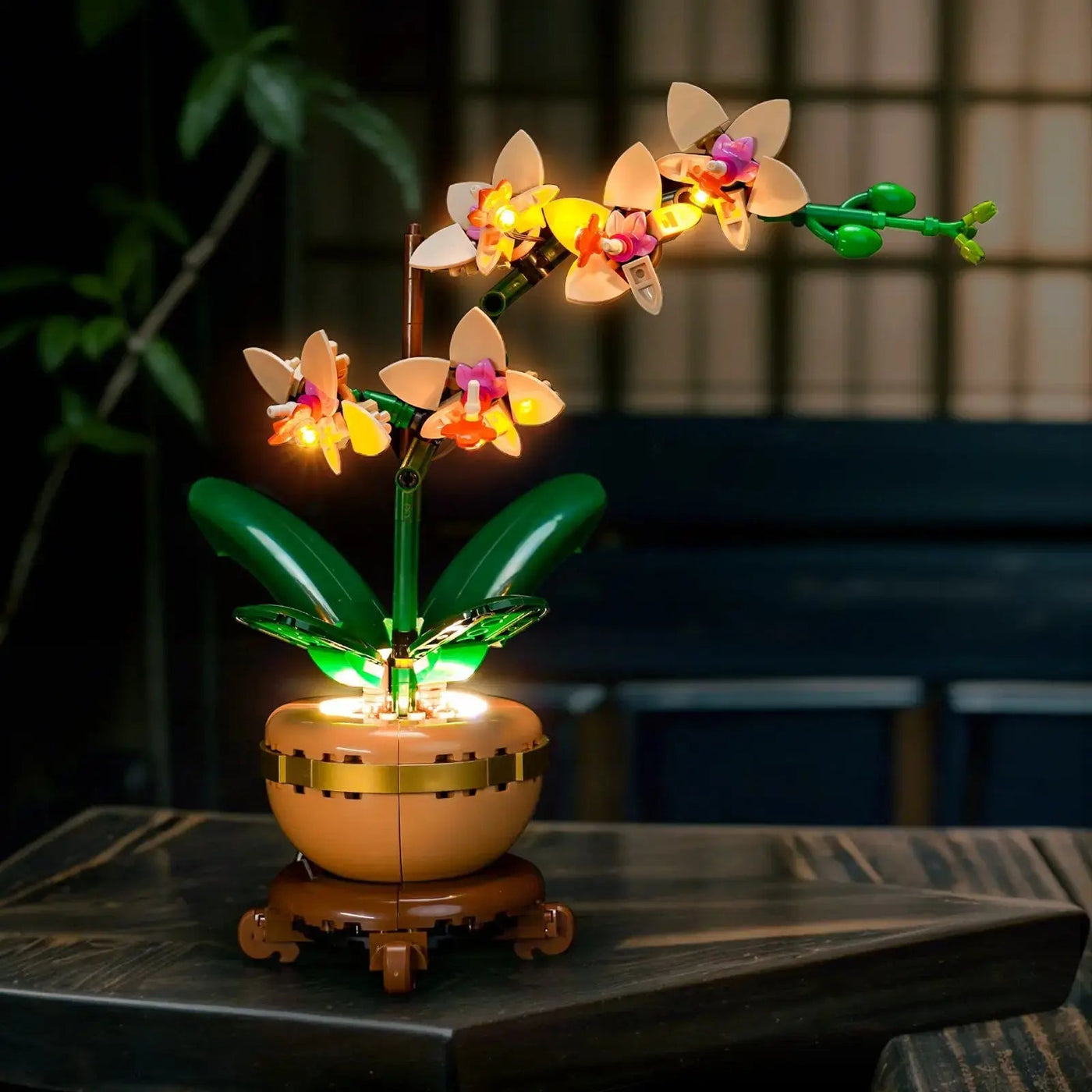 LEGO® The Botanical Collection Mini Orchid #10343 — side angle with lights on (DIY LED light kit)