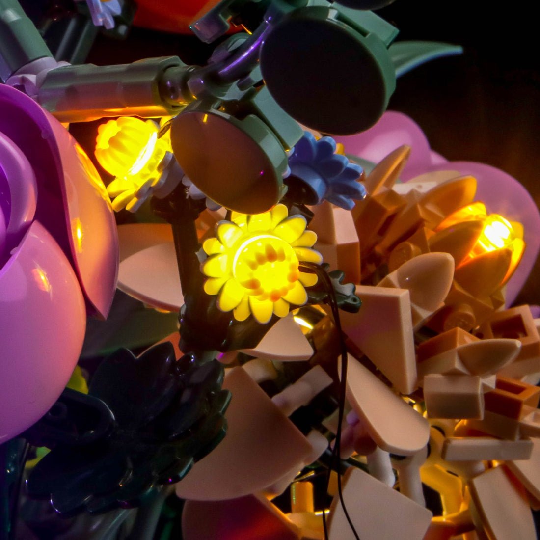 LEGO® The Botanical Collection Pretty Pink Flower Bouquet #10342 lighting effect on the build, with the LED lighting kit