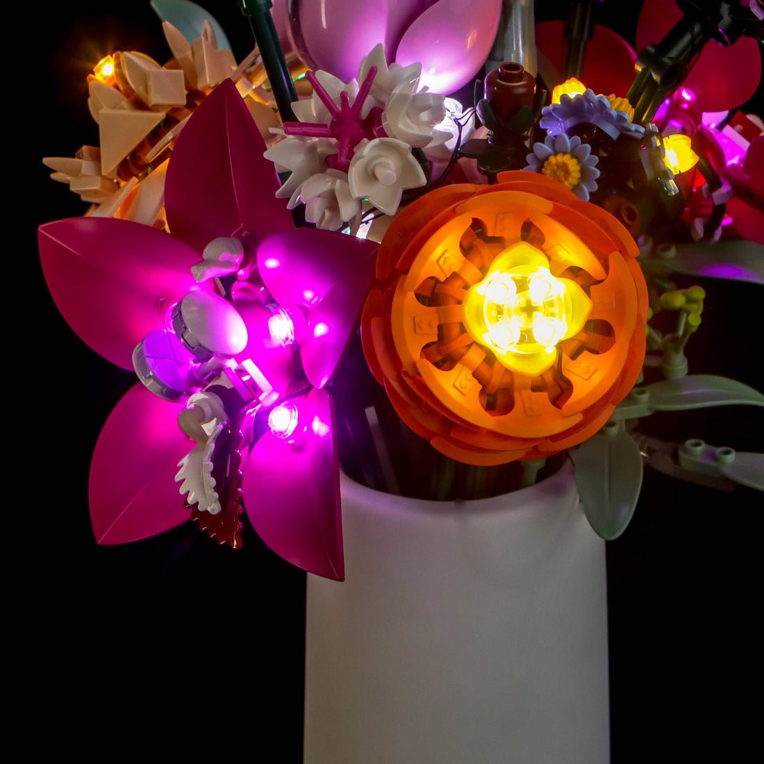 LEGO® The Botanical Collection Pretty Pink Flower Bouquet #10342 — front view fully lit (LED lights)