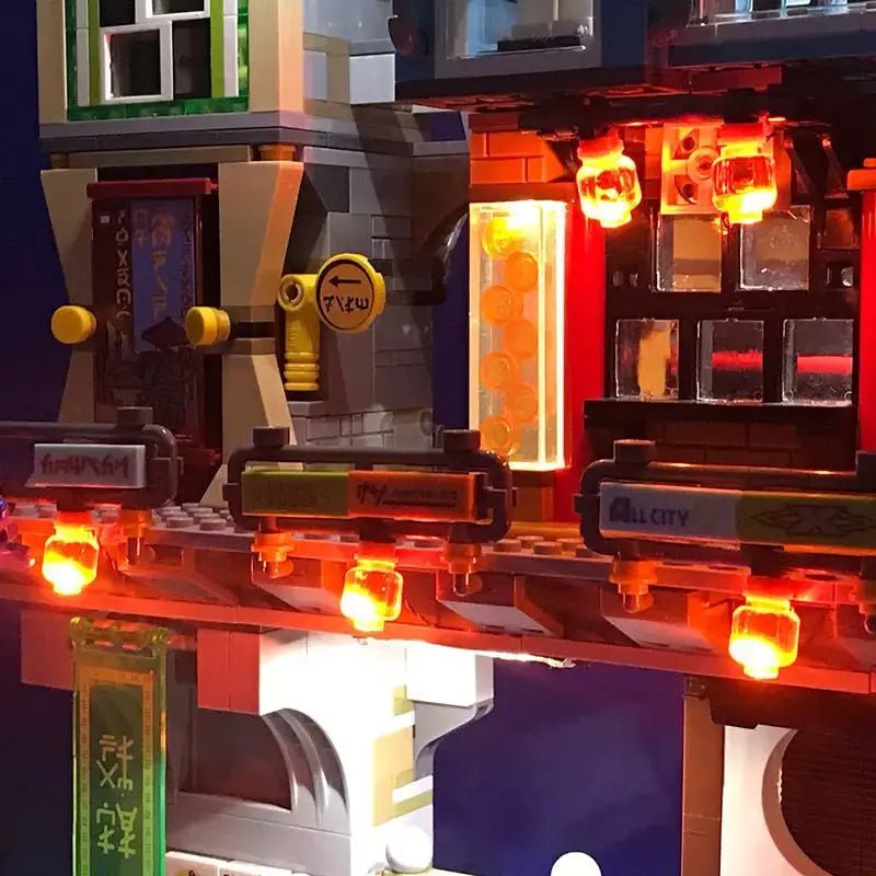 LEGO® The LEGO NINJAGO City #70620 front view fully lit, with the USB-powered LED light kit