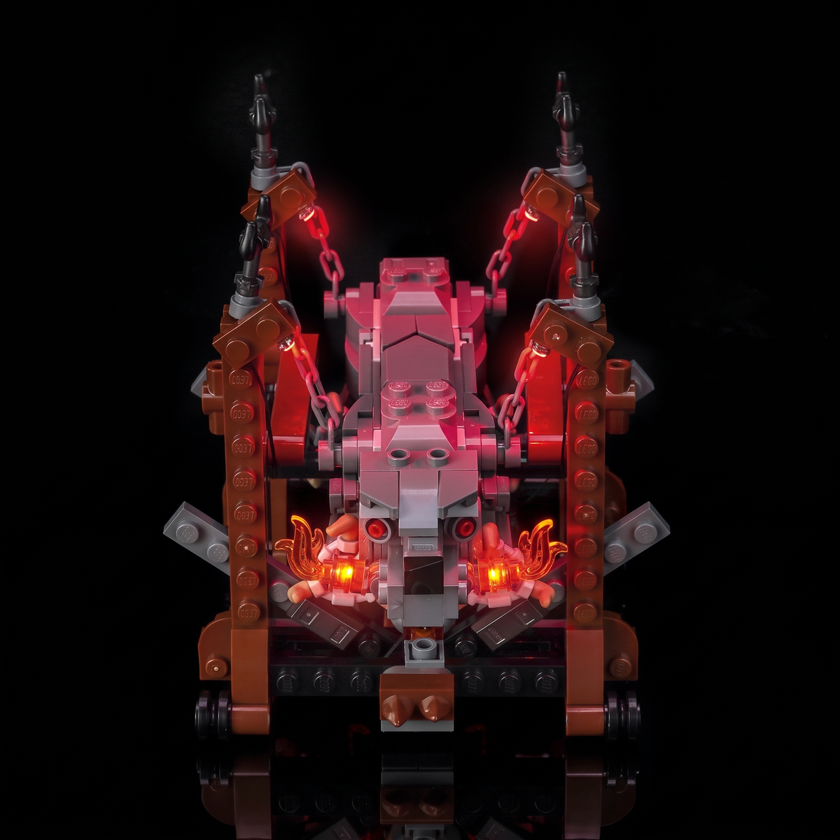 Raised front angle of the ram between the red-lit upright supports — LEGO® Grond #40893, LED light kit