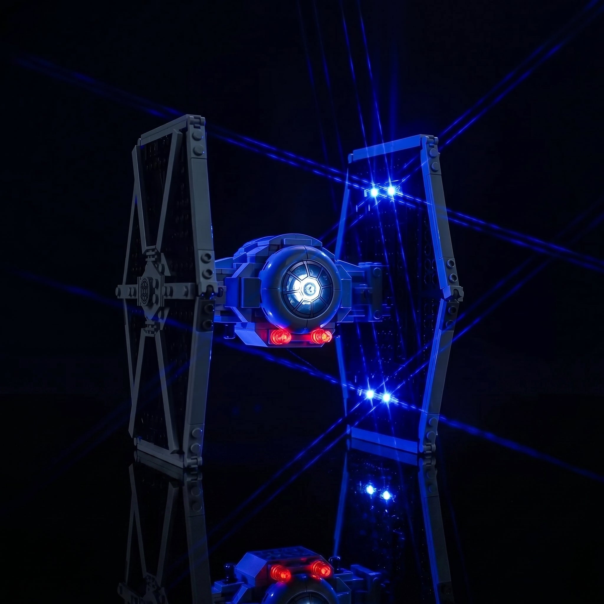 LEGO® TIE Fighter & X-Wing Mash-up #75393 fully illuminated on display, with the custom LED lighting