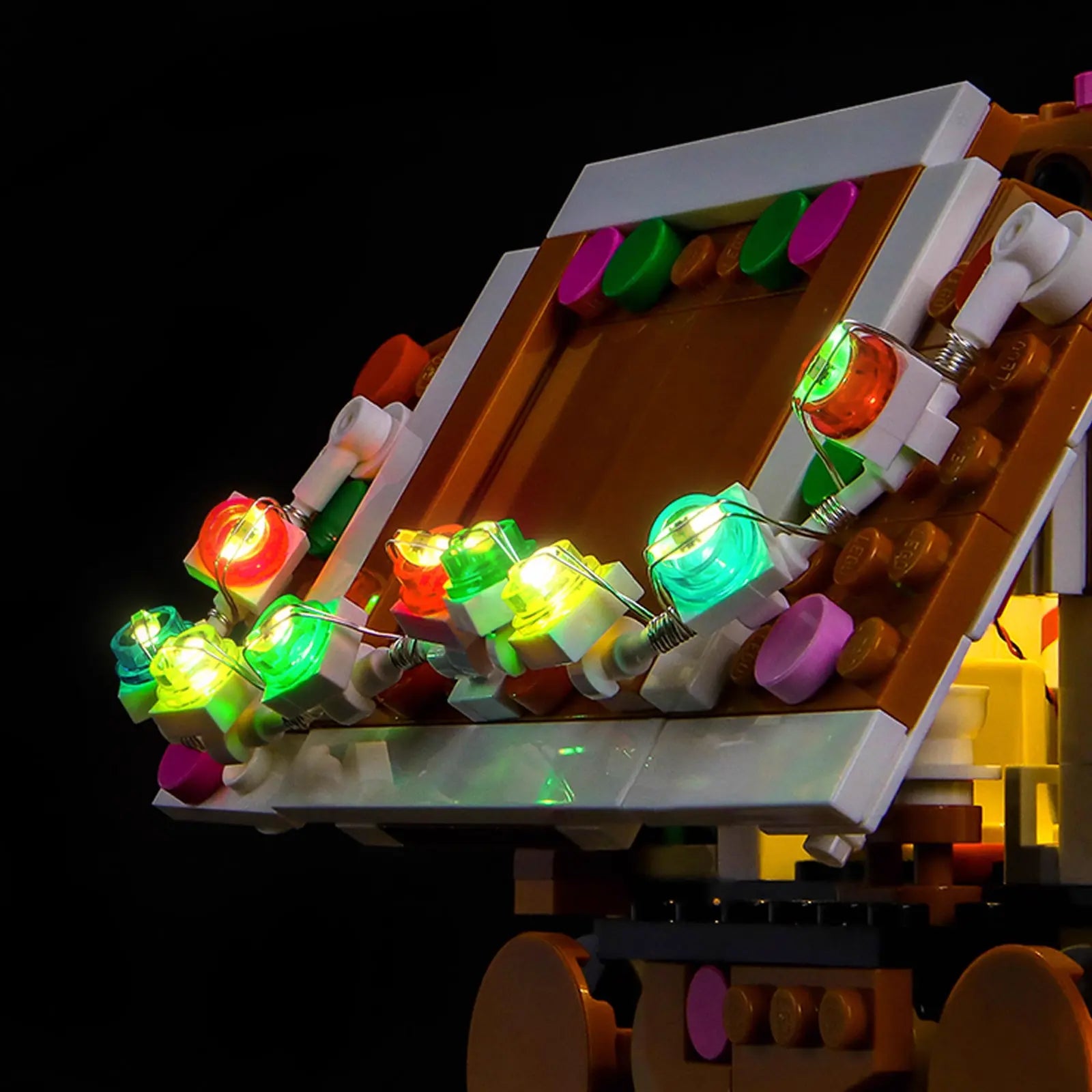 The feet of the LEGO Gingerbread AT-AT 40806 are highlighted, showing how the light kit illuminates every sweet detail.