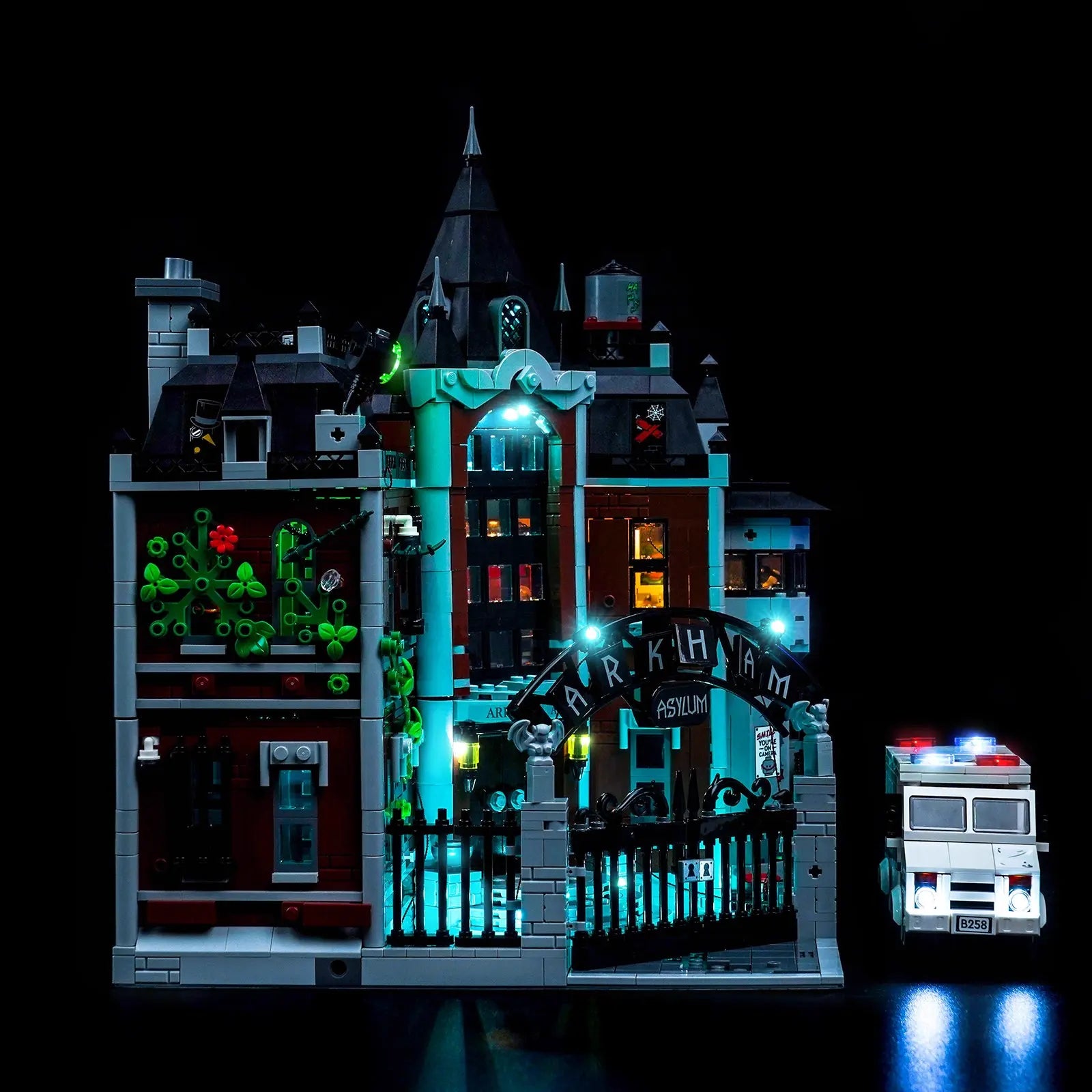A close-up of the main gate and the iconic "ARKHAM" sign, eerily illuminated by the Bright My Bricks light kit.