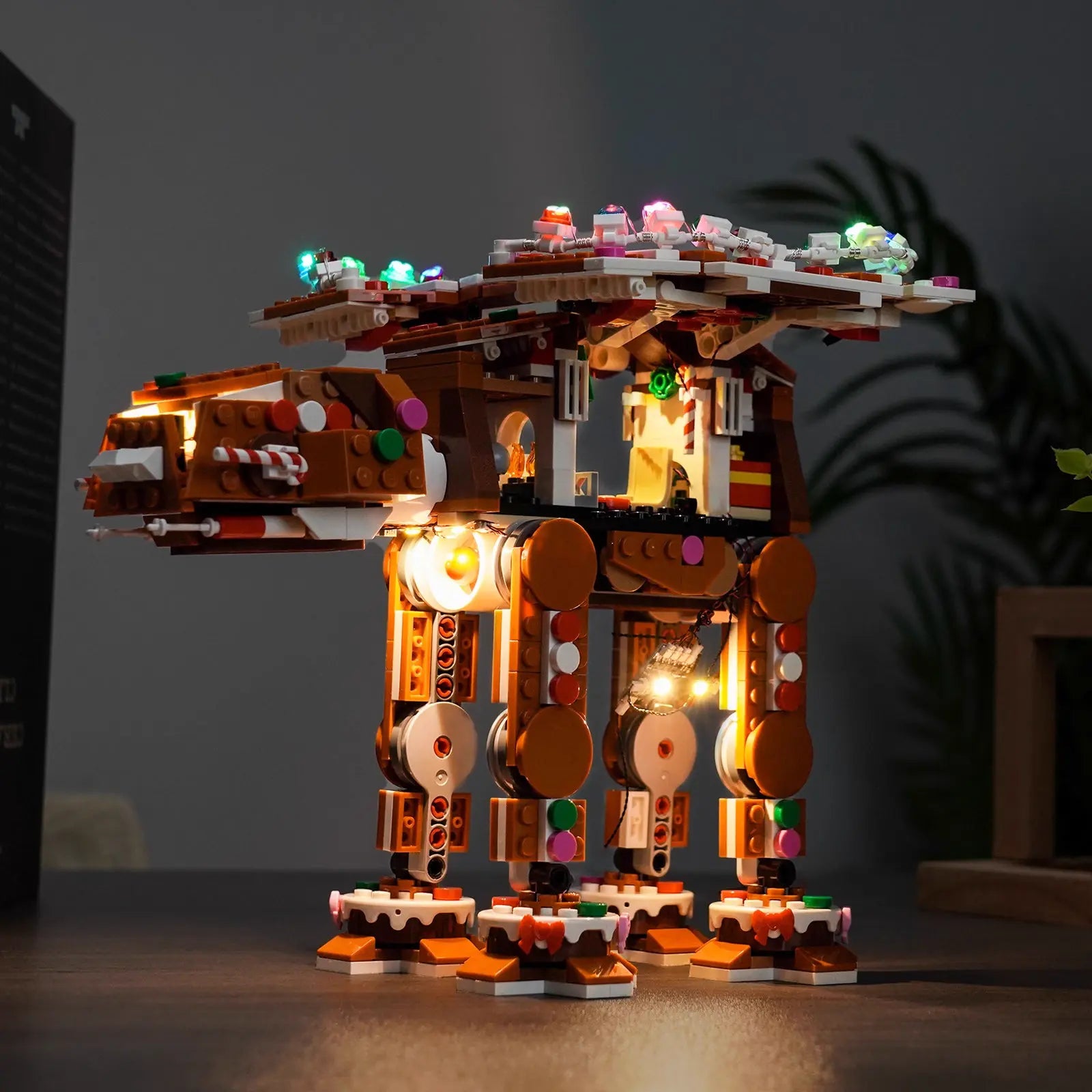 A magical nighttime display of the lit-up LEGO Gingerbread AT-AT 40806, creating a perfect Star Wars holiday scene.