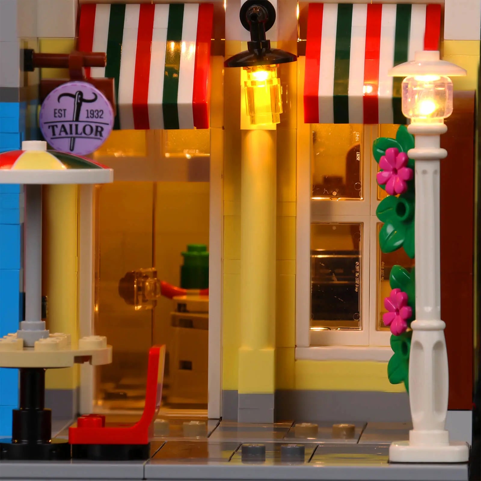 A dramatic nighttime shot of the LEGO Icons Jazz Club 10312, creating a realistic city scene with custom lighting.