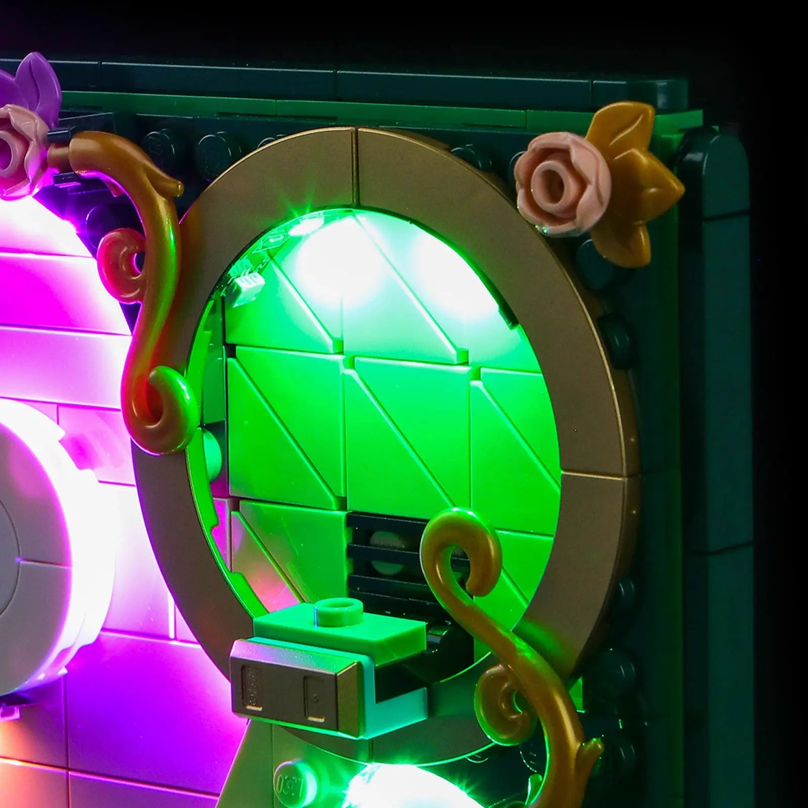 A stunning nighttime display of the LEGO Emerald City, with the Bright My Bricks kit creating a dramatic, magical scene.