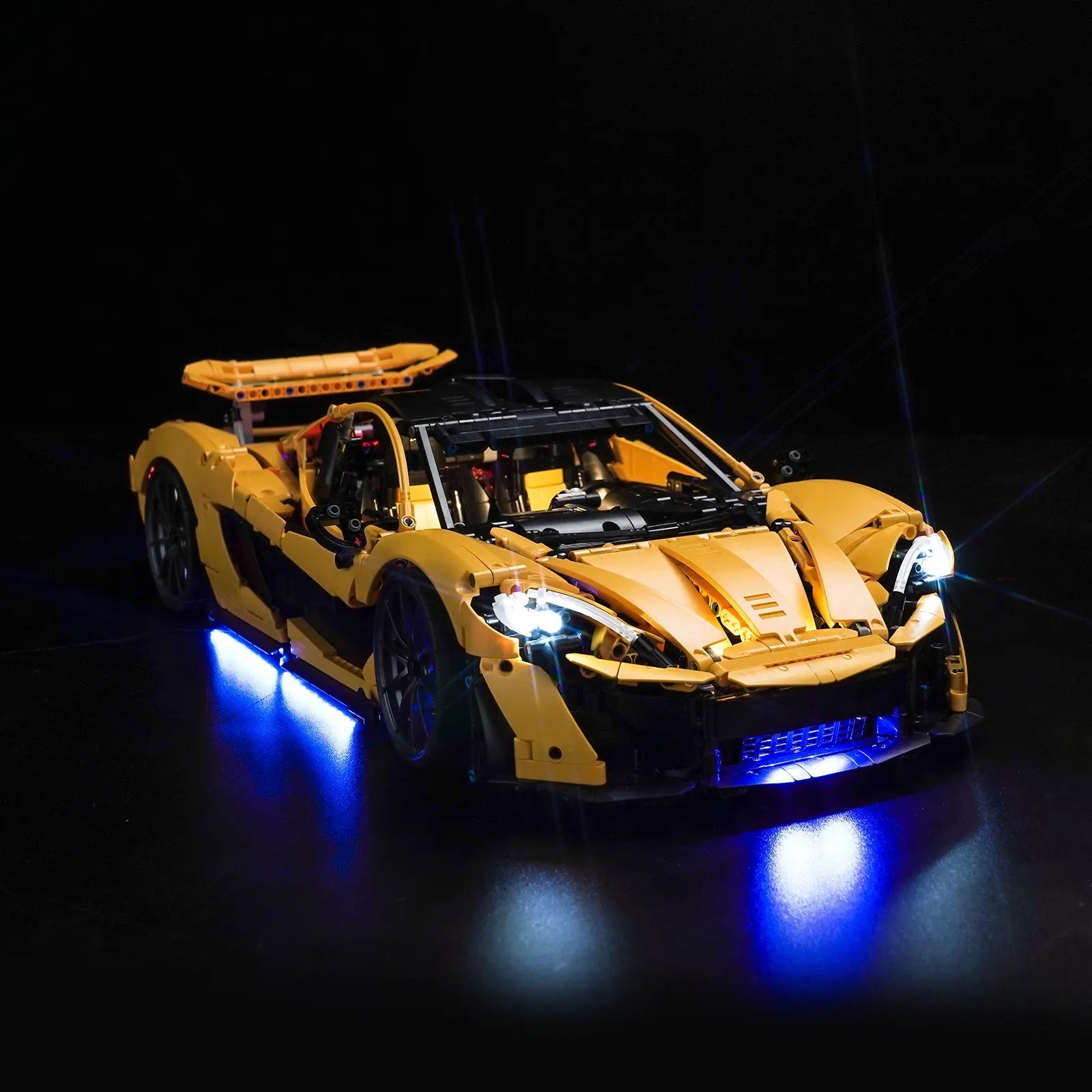 A stunning rear view of the LEGO McLaren P1 42172 with its taillights and engine bay glowing intensely from our light kit.