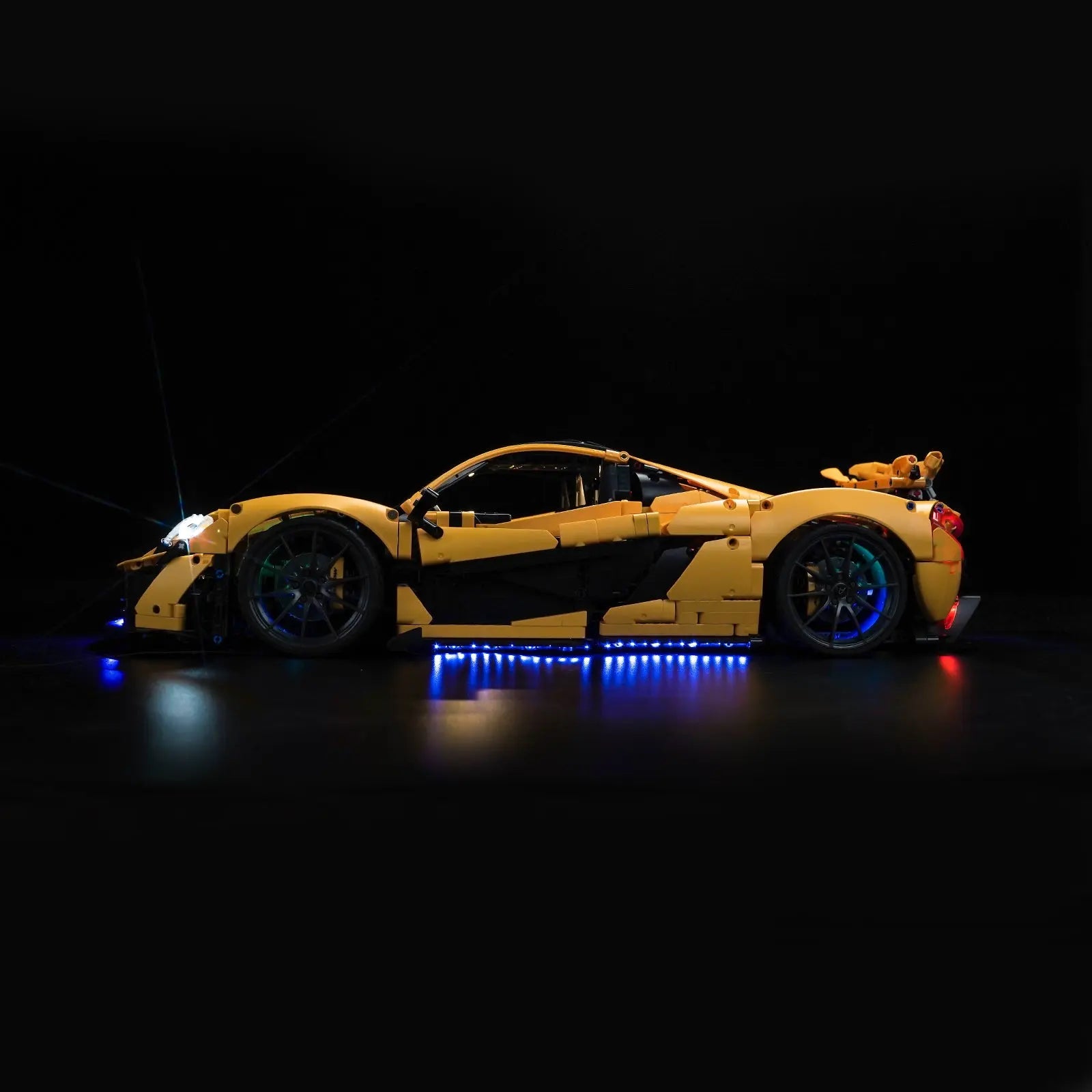 The LEGO Technic McLaren P1 42172 light kit being activated with the included remote control by Bright My Bricks.