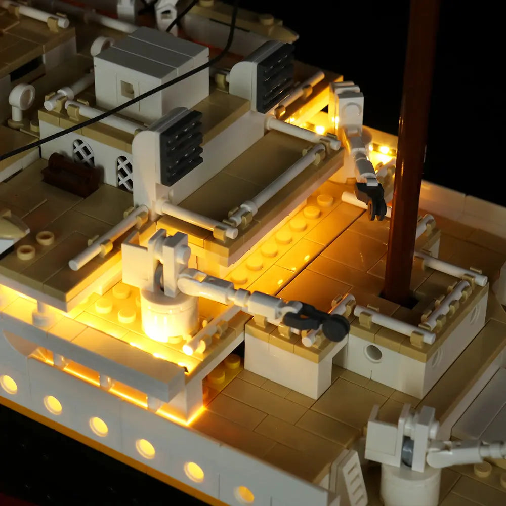 The rear deck and stern of the LEGO Titanic 10294 are beautifully lit, showcasing the ship's grand scale.