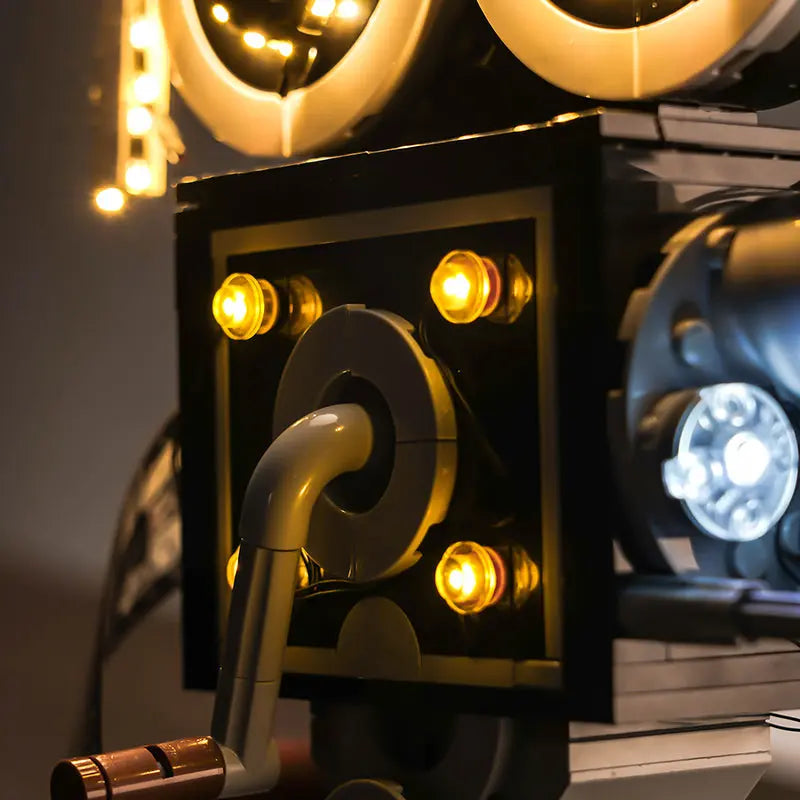 The Walt Disney minifigure and clapperboard are highlighted by a gentle, warm spotlight from our LEGO 43230 light kit.