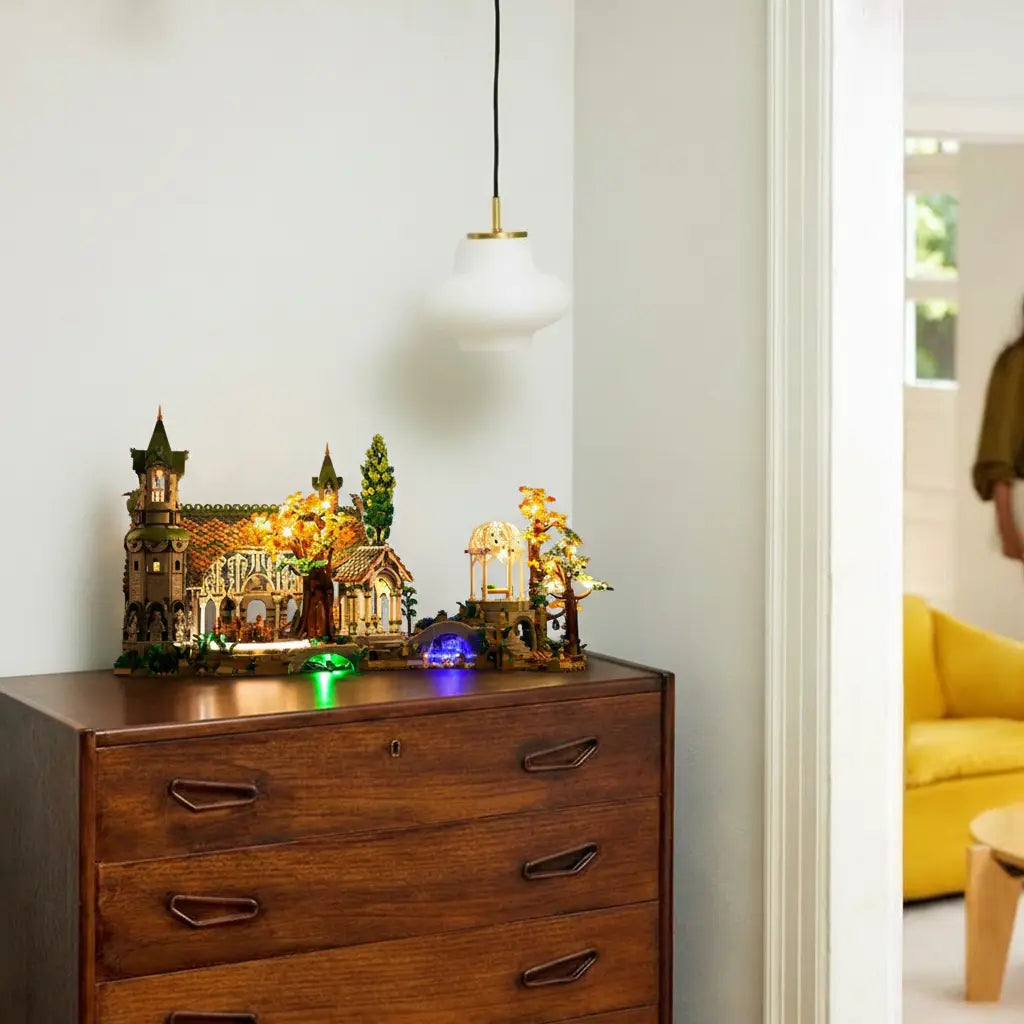 The ethereal beauty of LEGO Rivendell 10316 is enhanced by a custom warm light kit, creating a magical, elven glow.